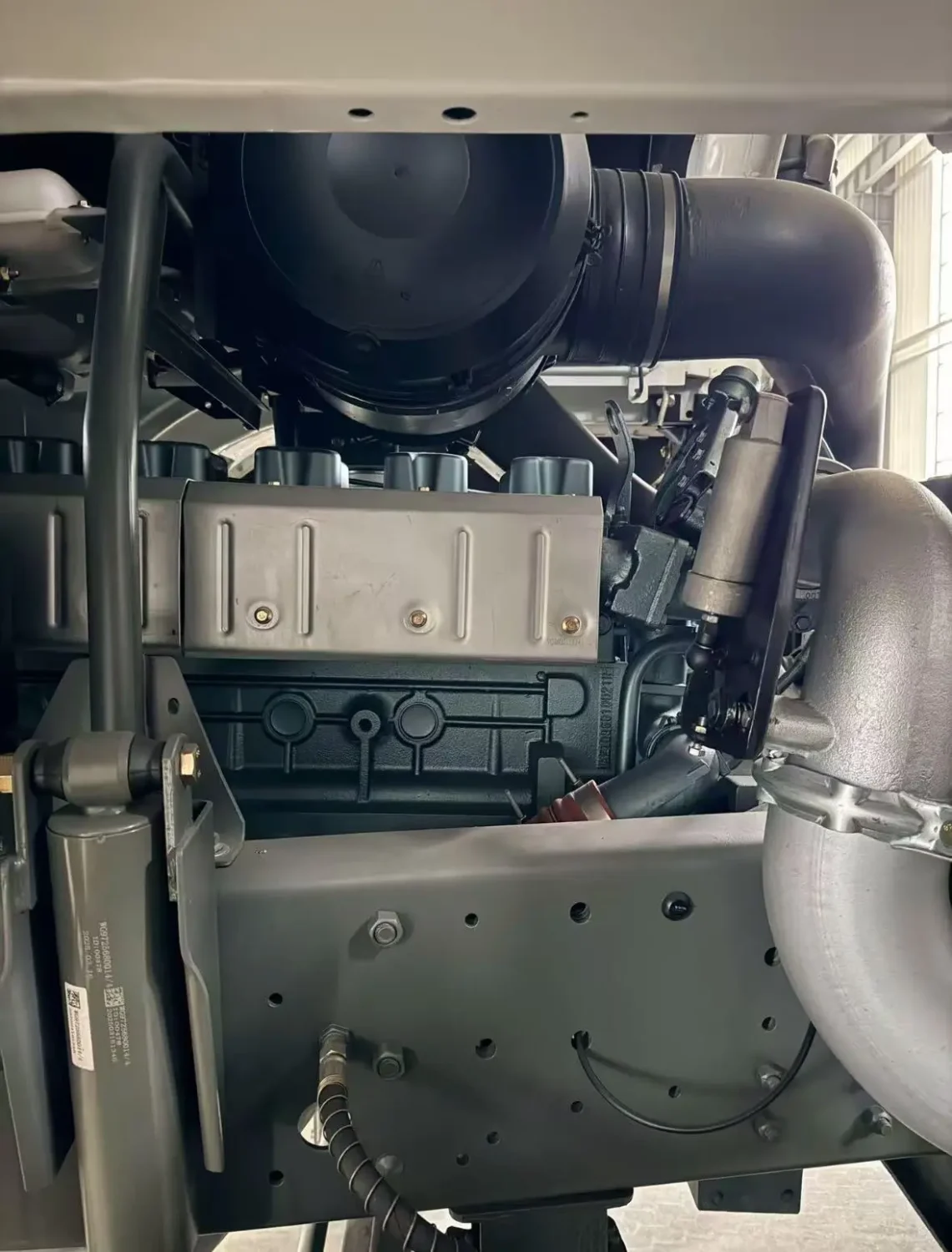 Engine bay of a HOWO 6x4 dump truck during the pre-shipment inspection